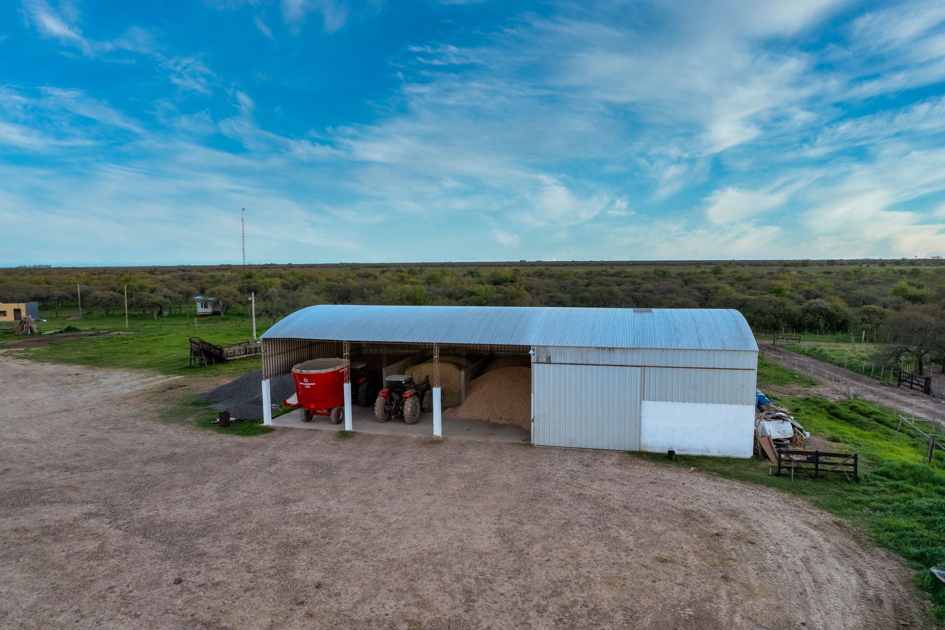 Shed in the middle of a field where tractors and agricultural machinery are kept. Shed in the middle of a field where tractors and agricultural machinery are kept.