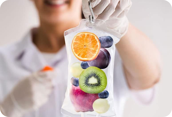 A woman is holding a bag of fruit in her hand.