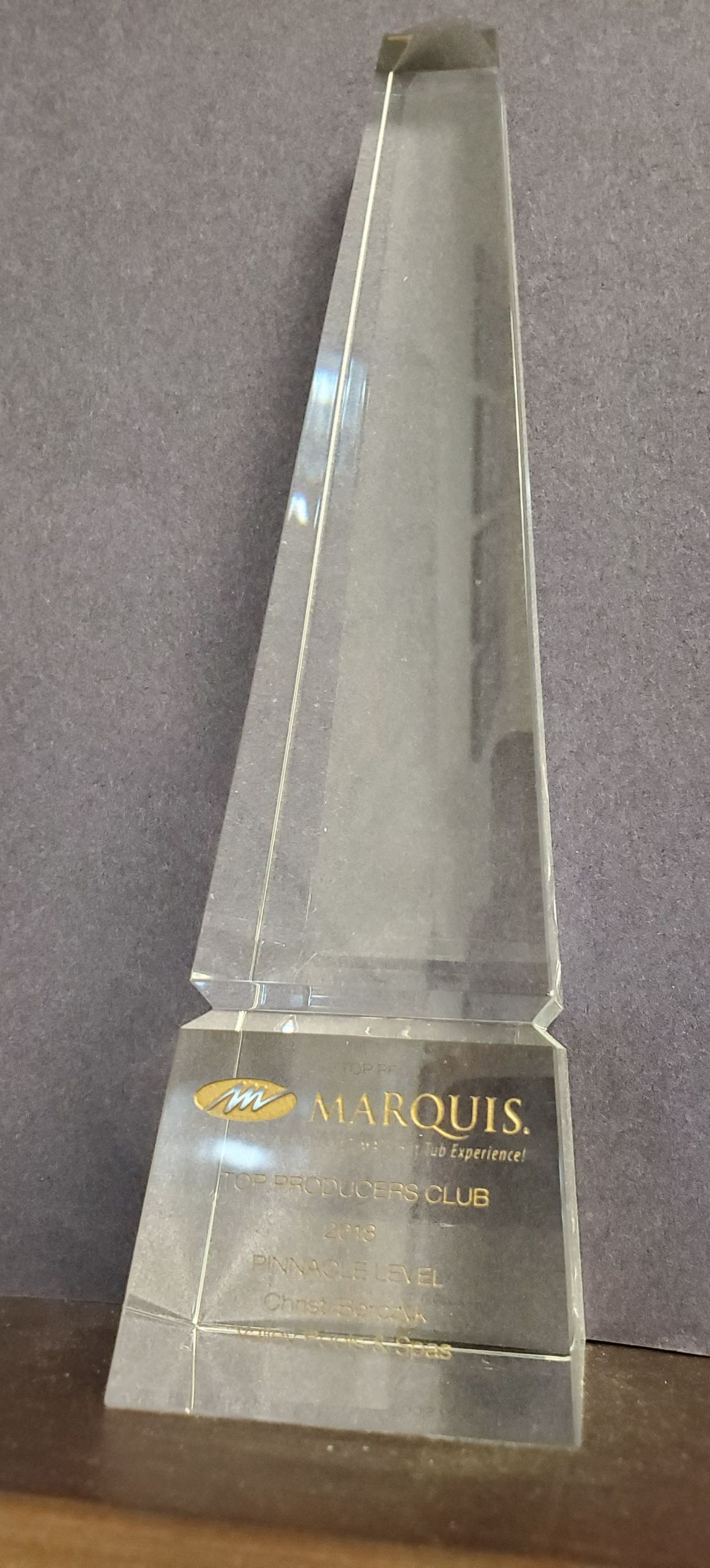 Glass award with a Ford logo and the word