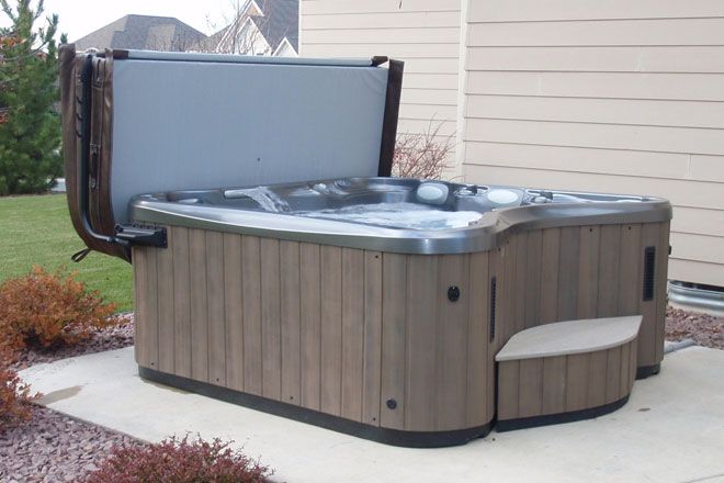 Hot Tub Pouring with Warm Water — Burnsville, MN — Valley Pools & Spas