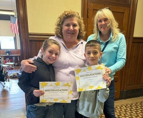 A group of people are standing next to each other holding certificates.