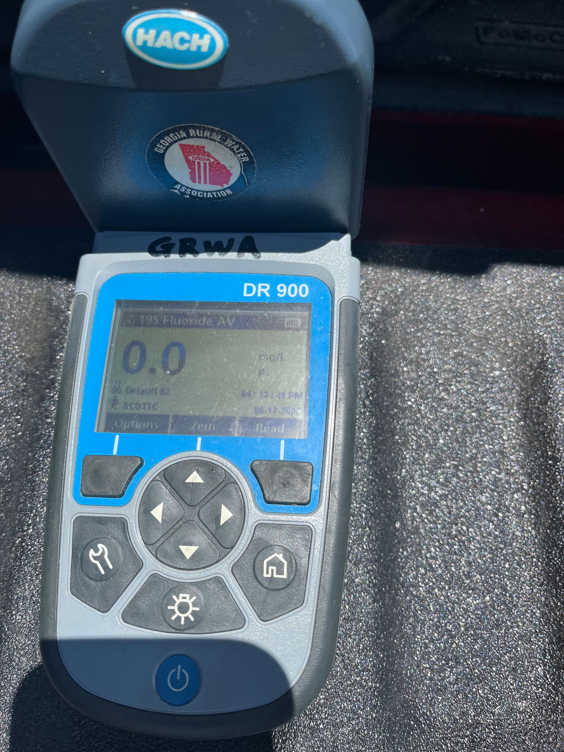 Hach DR 500 water quality meter, gray and blue, displays 0.0 reading on a screen with other parameters.