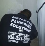 Man Wearing Black Company Shirt— Rancho Cucamonga, CA — Advanced Plumbing Solutions