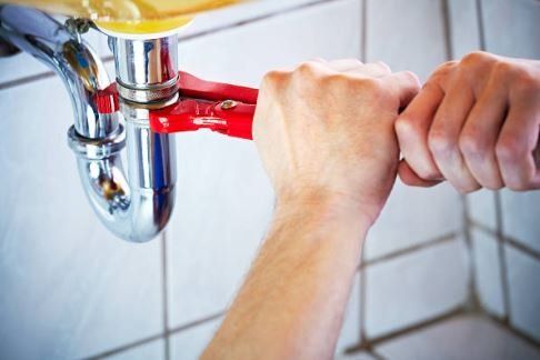 Tightening Using Red Wrench — Rancho Cucamonga, CA — Advanced Plumbing Solutions