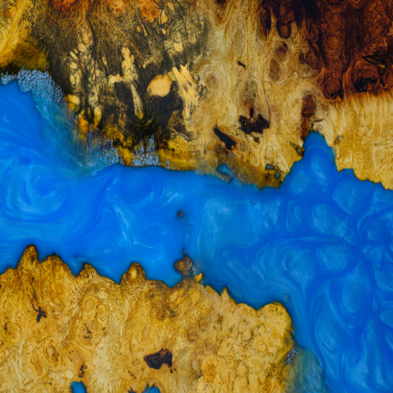 A close up of a piece of wood and resin that looks like a river.