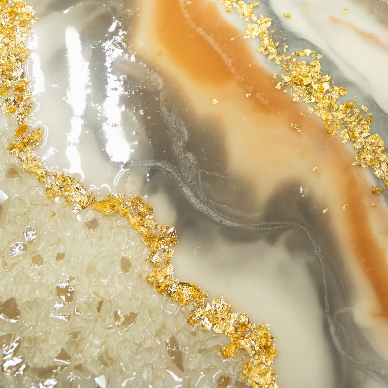A close up of a piece of marble with gold flakes on it.