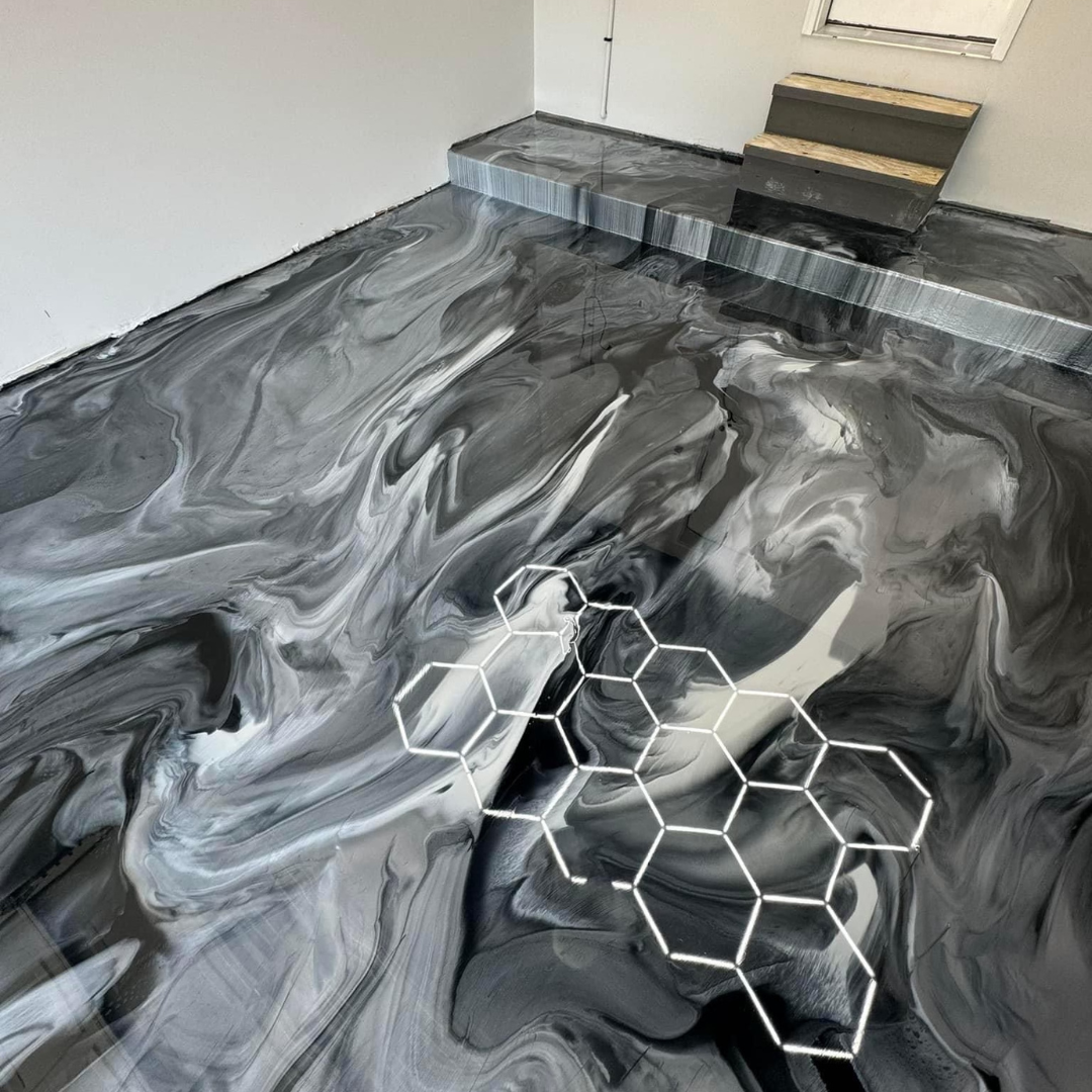 A black and white marble floor with a honeycomb design on it.