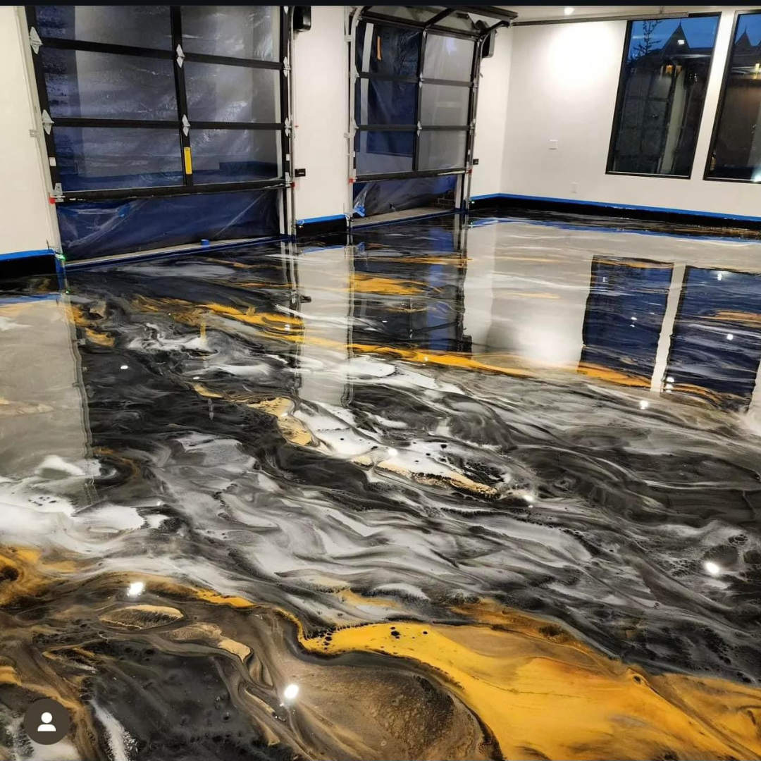 A garage with a black , white and yellow epoxy floor.