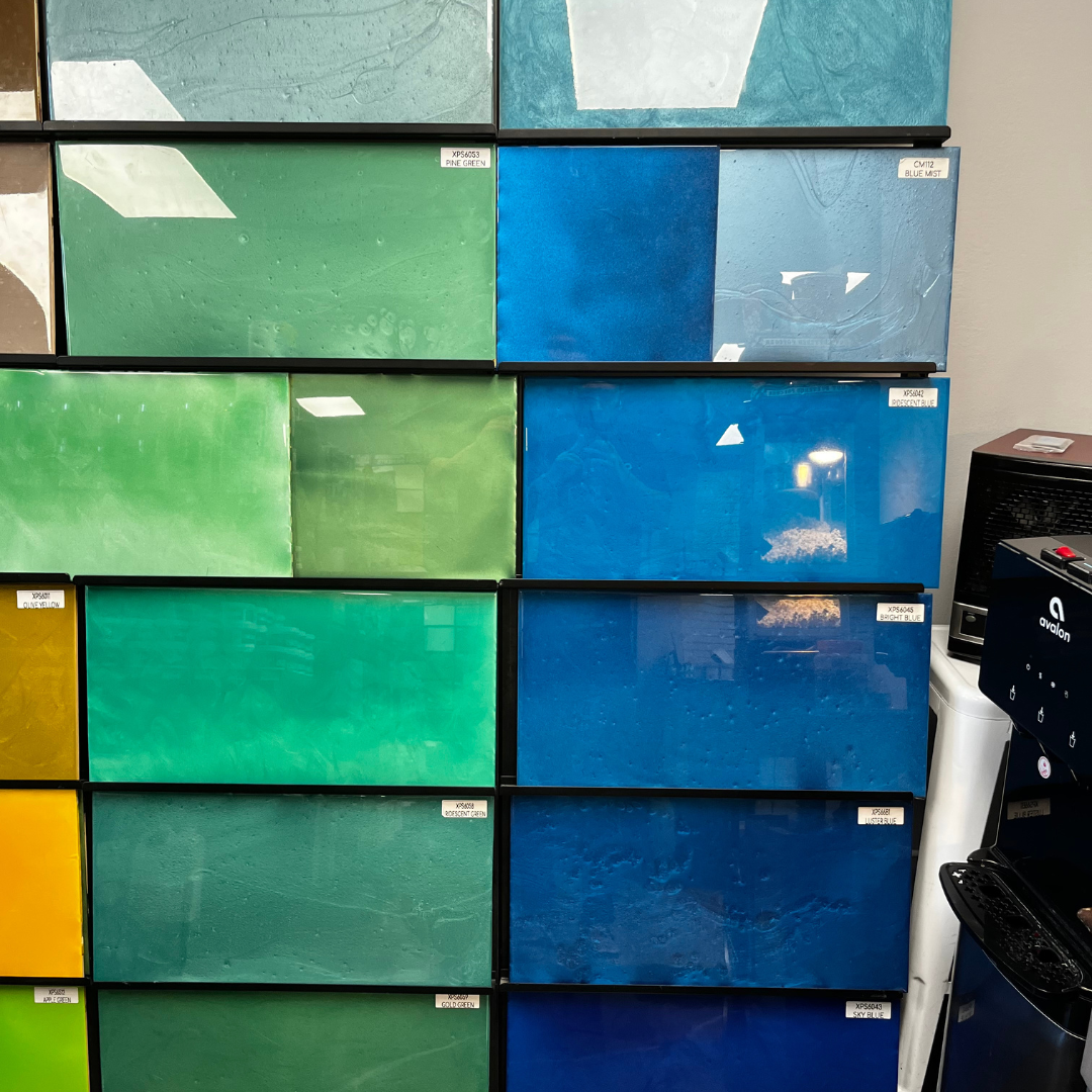 A stack of blue green and yellow tiles on a wall