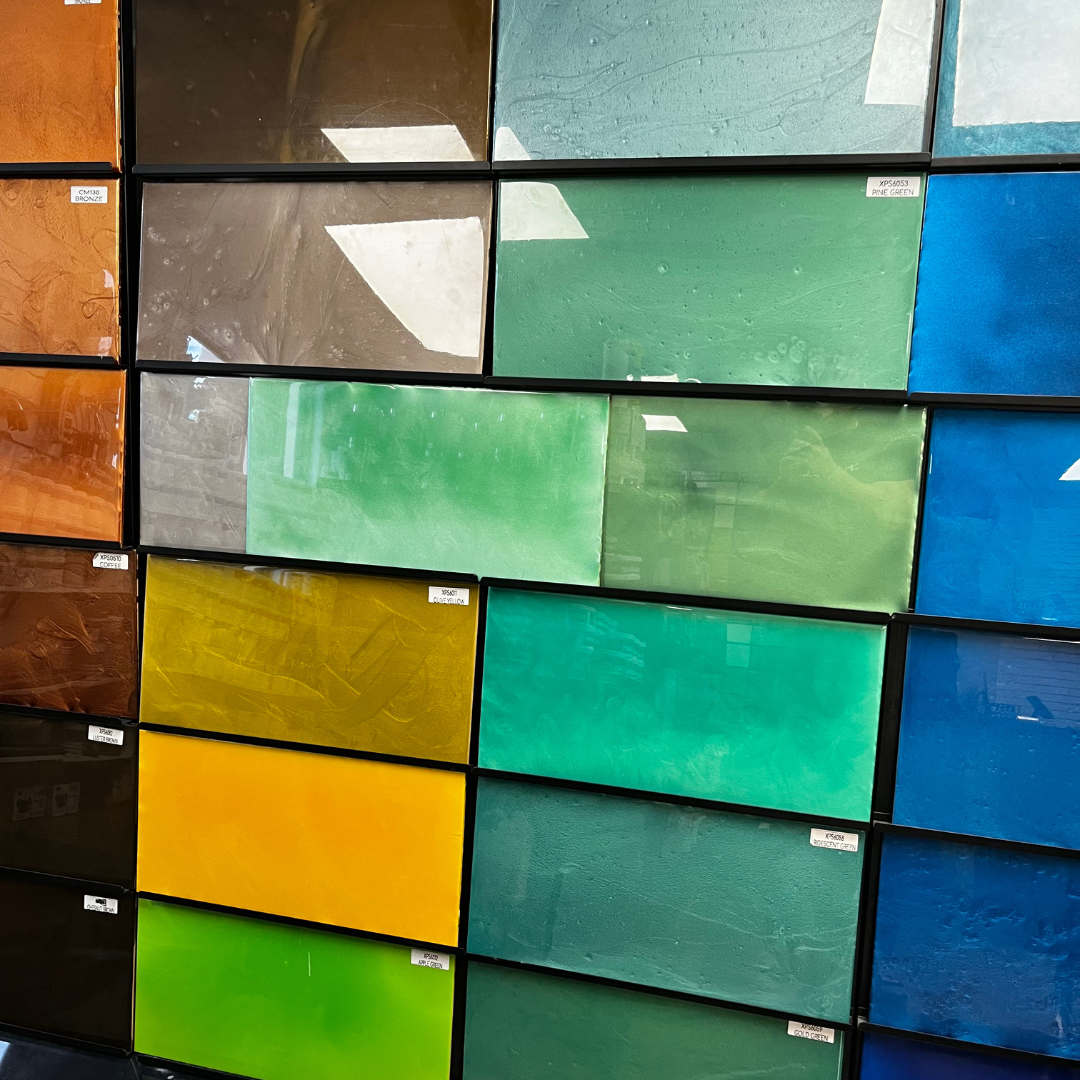 A wall with many different colored tiles on it