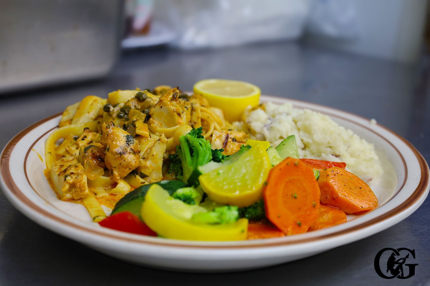 Chicken Piccata served with Mashed Potatoes and Steamed Vegetables