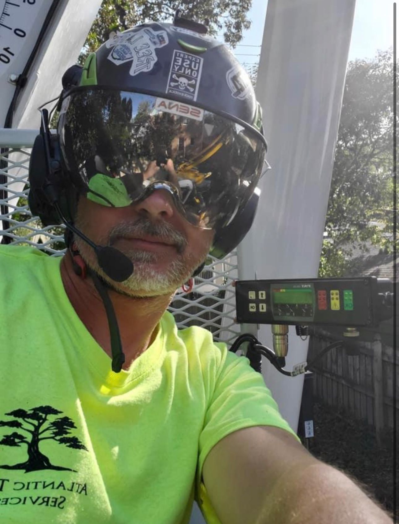 A man wearing a helmet and goggles is taking a selfie