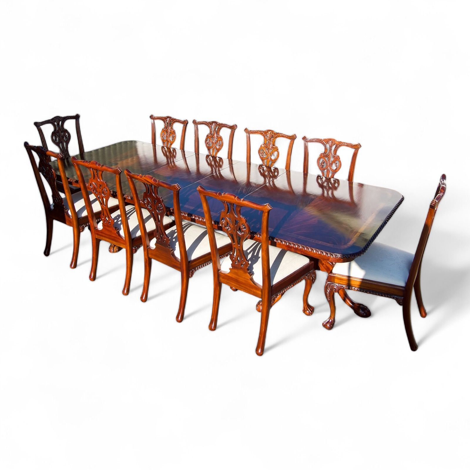 flamed mahogany extending dining table and chairs