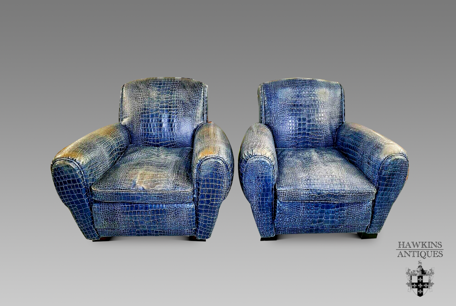 pair of blue leather club armchairs