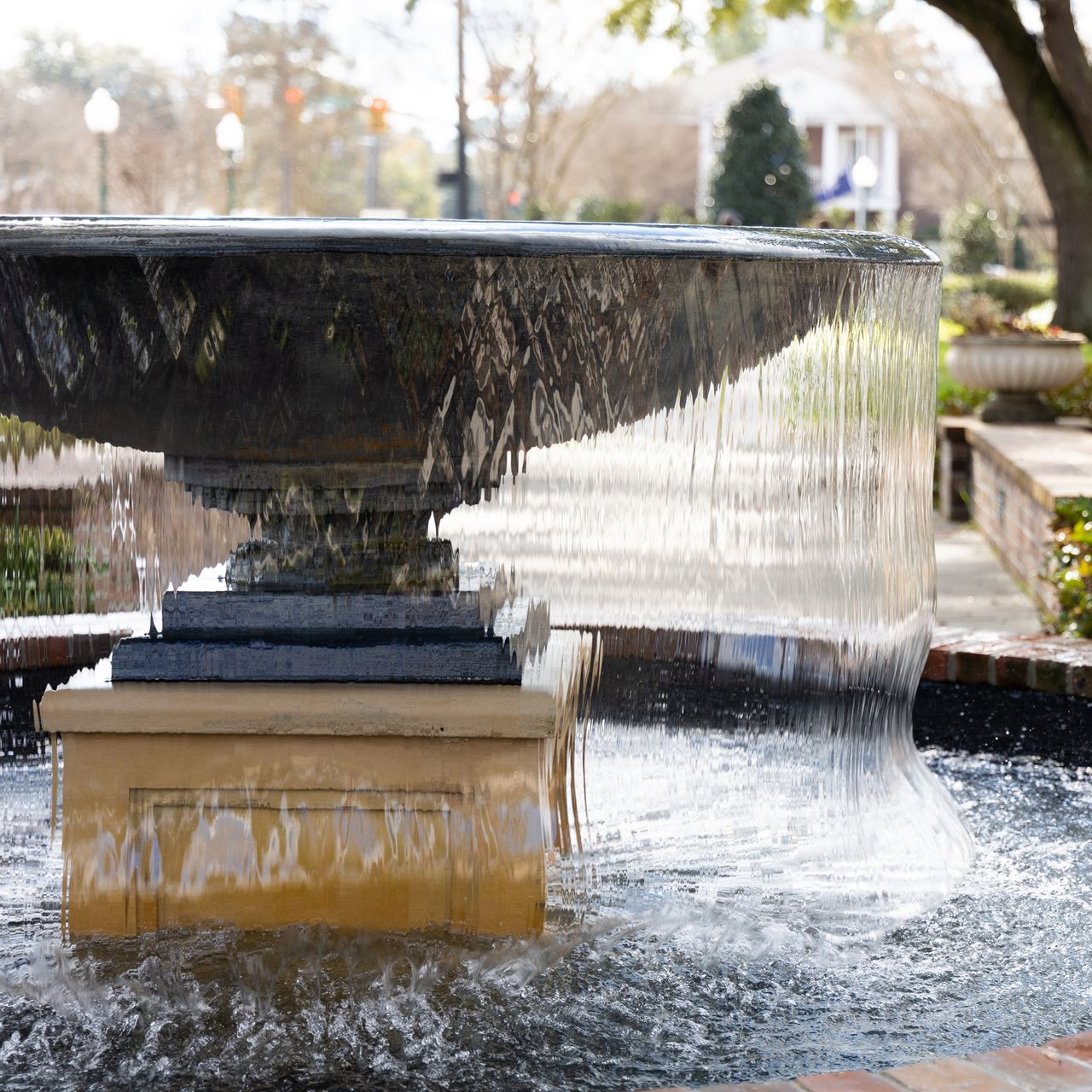Fountain in Hutchinson Square, Main Street, Summerville, SC. Photo features  water cascading over edges.