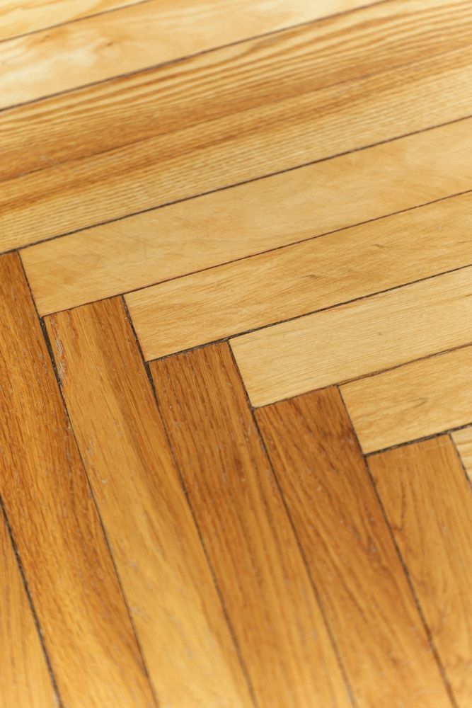 Light-colored Wooden Floor In A Herringbone Pattern — Scott Johnston Floor Sanding in Mareeba, QLD