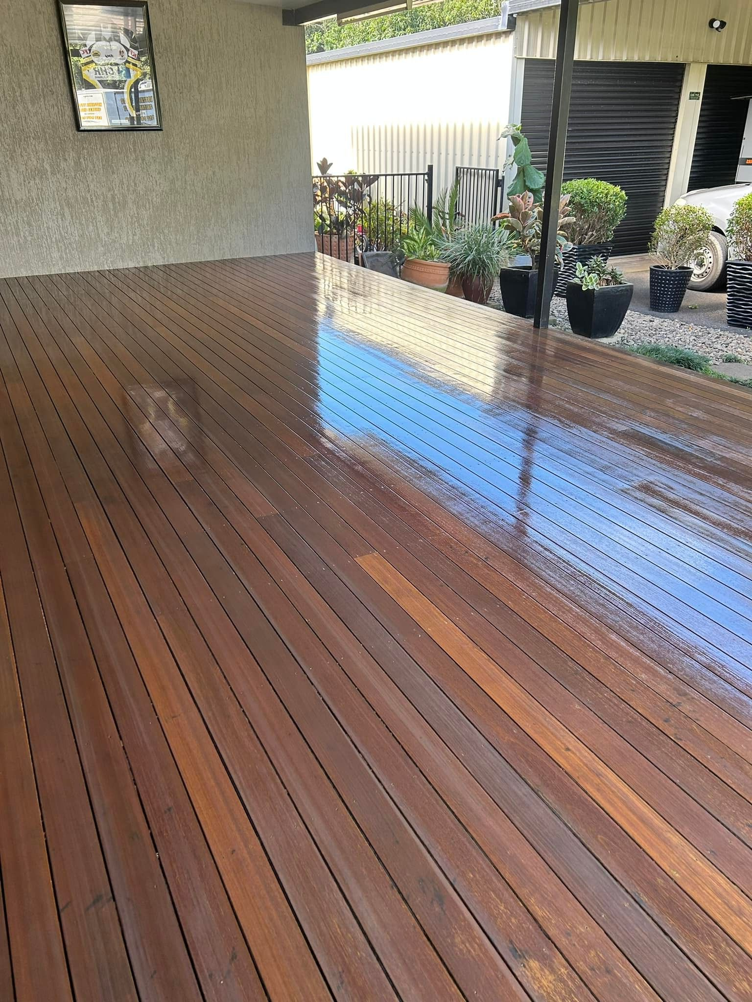 Wooden Deck With Weathered Planks And Dappled Sunlight — Scott Johnston Floor Sanding in Bentley Park, QLD