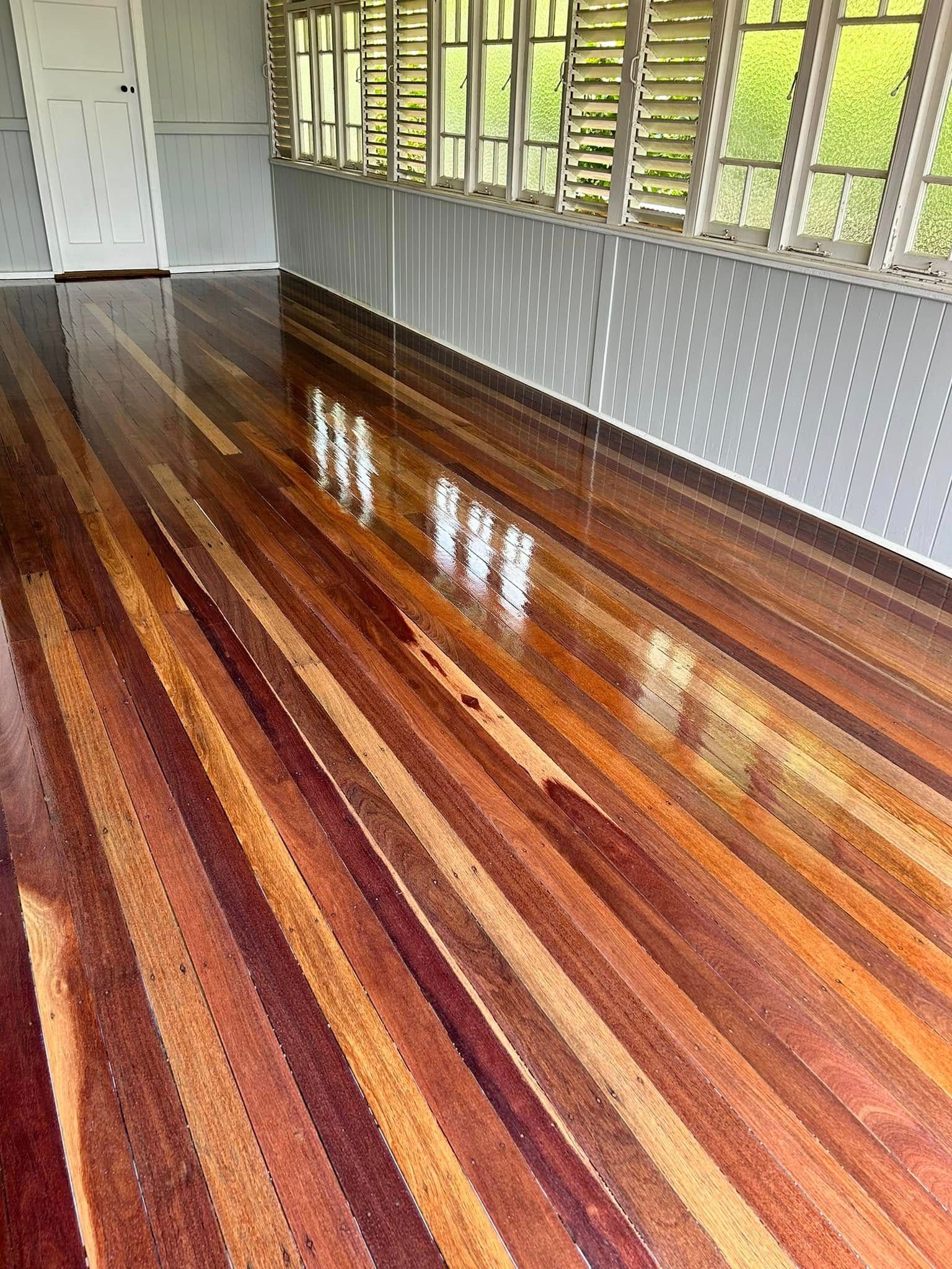 Shiny Wooden Floor With Varied Reddish-brown Tones — Scott Johnston Floor Sanding in Bentley Park, QLD