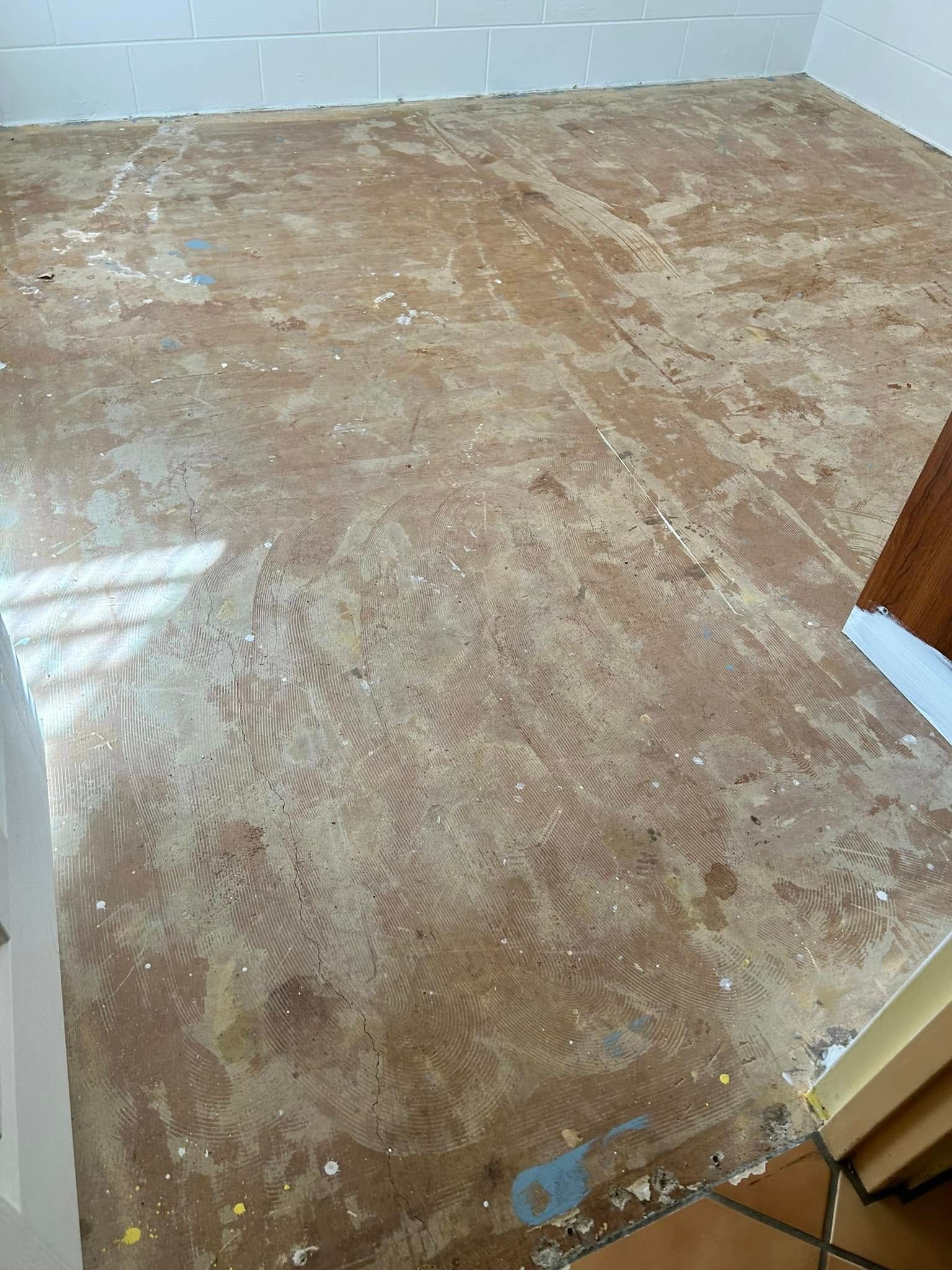 Bare Concrete Floor With Scattered Debris — Scott Johnston Floor Sanding in Bentley Park, QLD