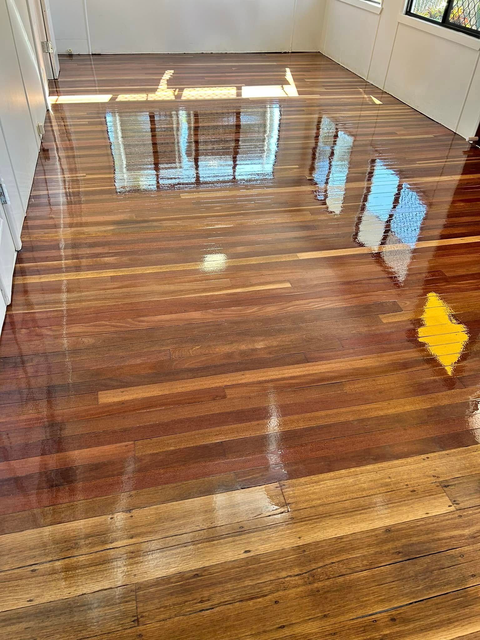 Shiny, Multi-toned Wooden Floorboards With A Reflective Surface — Scott Johnston Floor Sanding in Bentley Park, QLD