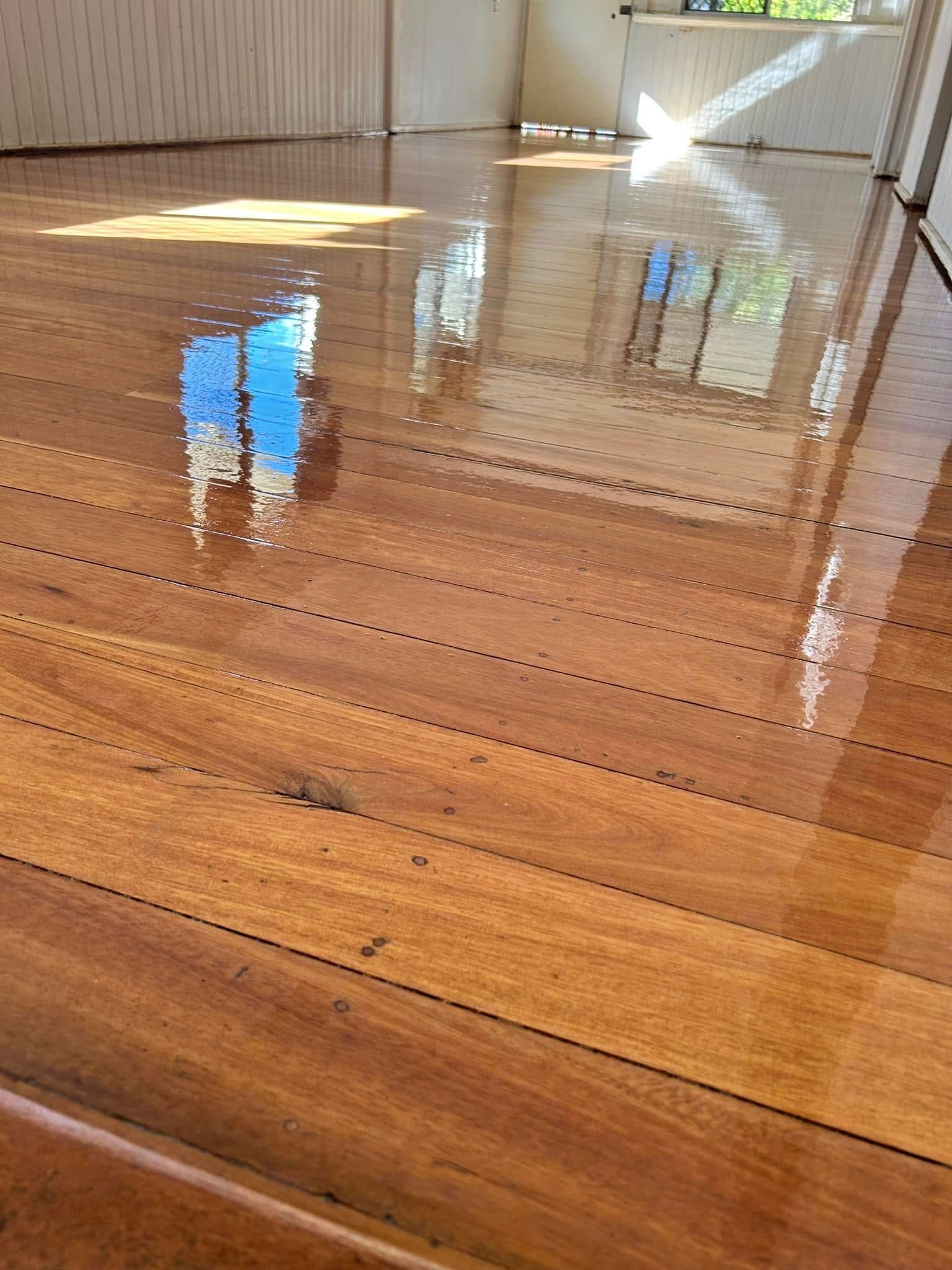 Reflective Wooden Floor With Shiny Varnish — Scott Johnston Floor Sanding in Bentley Park, QLD