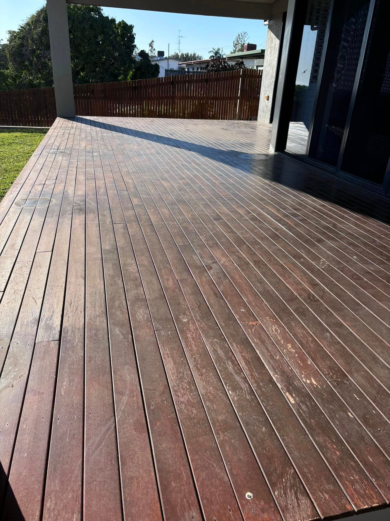 Wooden Deck With Weathered Planks in Sunlight — Scott Johnston Floor Sanding in Bentley Park QLD