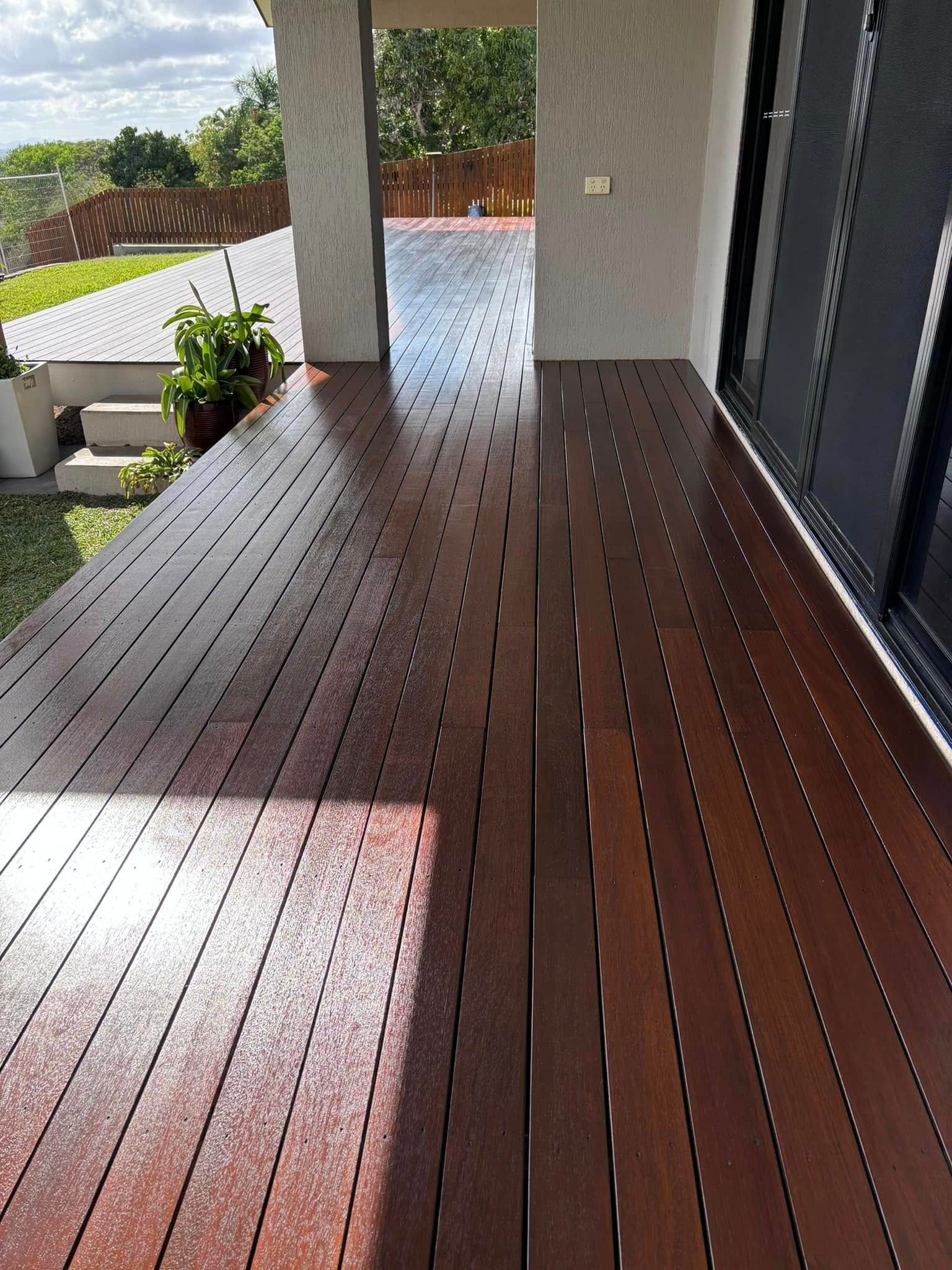 Wooden Deck With Vertical Planks, Brown Stain — Scott Johnston Floor Sanding in Bentley Park QLD