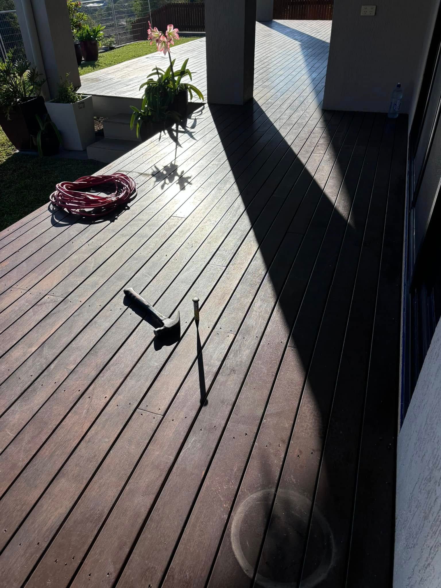 Wooden Deck With Strong Shadows From Pillars — Scott Johnston Floor Sanding in Bentley Park QLD