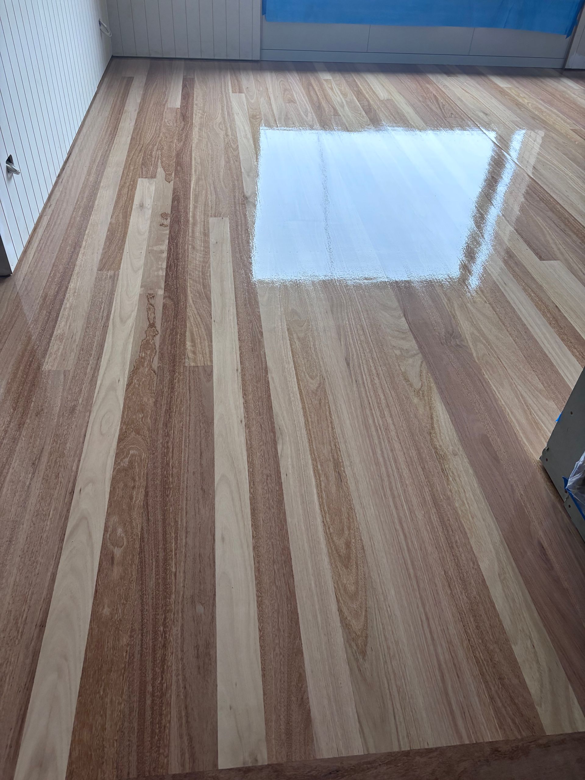 Wooden Floor With Alternating Light and Dark Wood Planks — Scott Johnston Floor Sanding in Bentley Park QLD