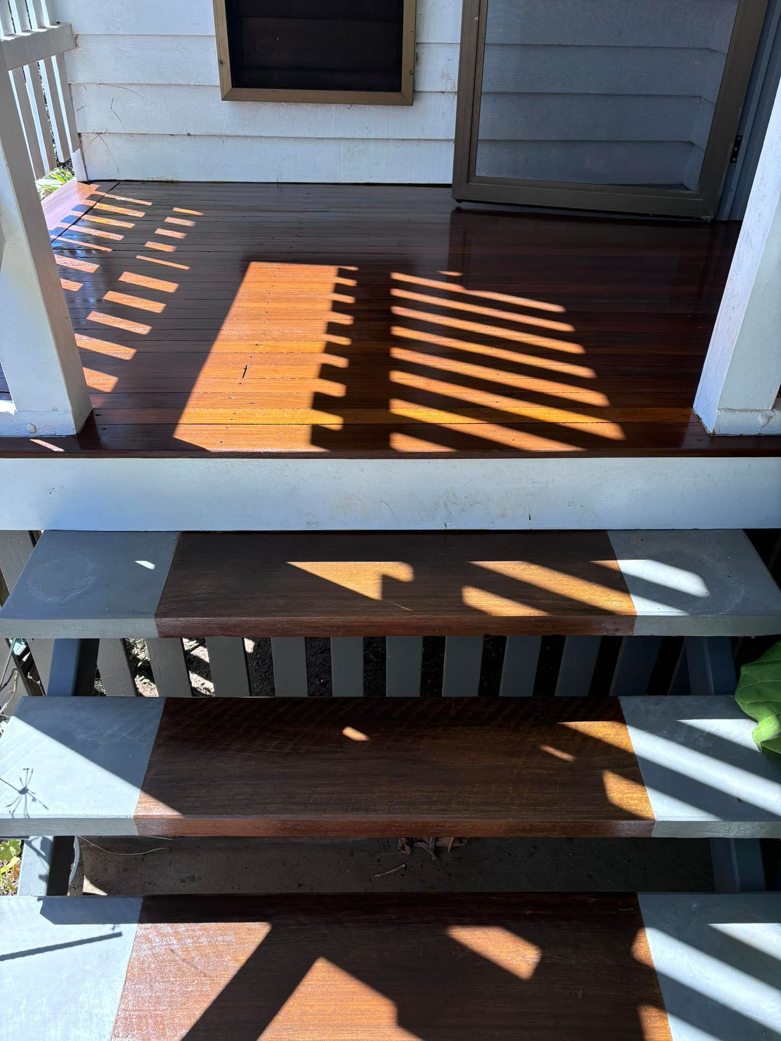 Person Working On Wooden Staircase — Scott Johnston Floor Sanding in Mareeba, QLD