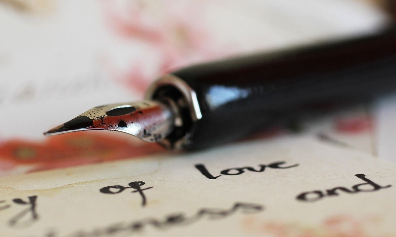 A fountain pen lying over a letter