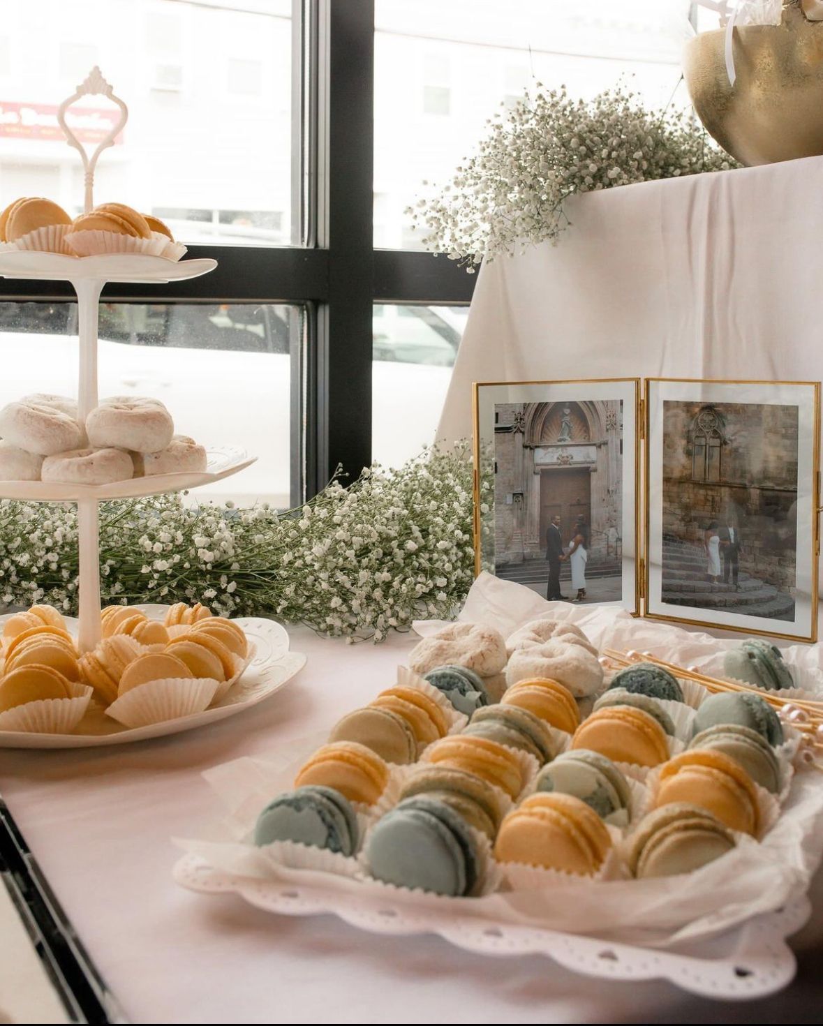 A table with a tray of macarons on it