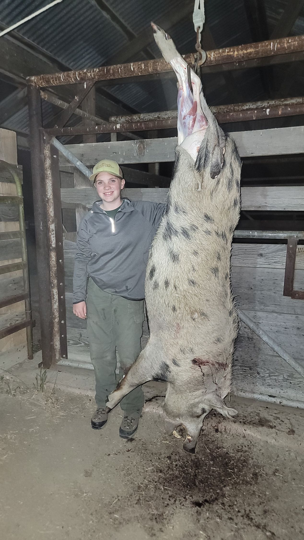 Youth hunter with giant trophy boar from guided hunt
