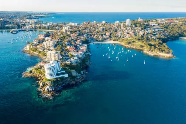 An aerial view of the northern beaches on a small island in the middle of the ocean.