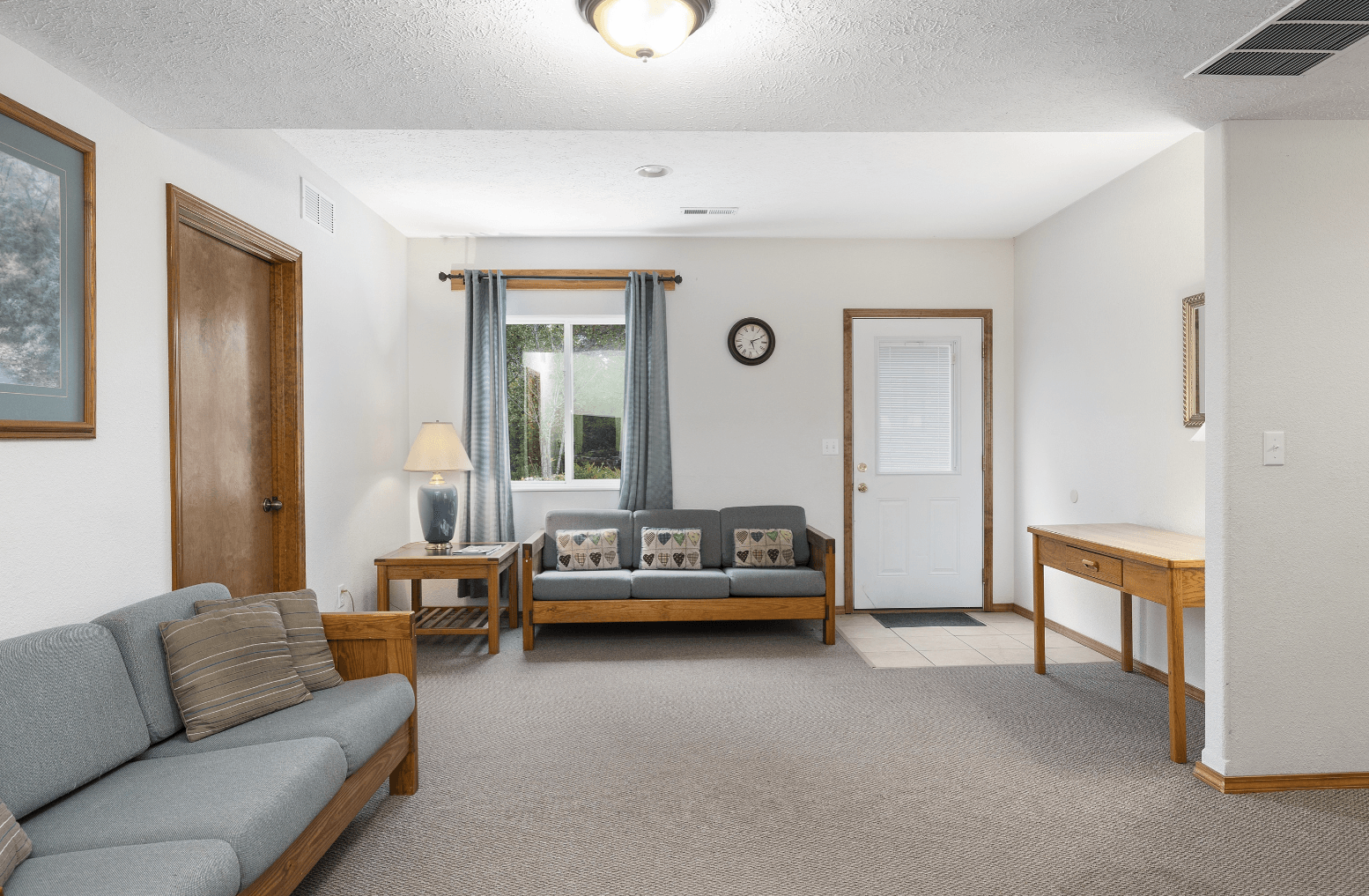 A living room with a couch and a table in it