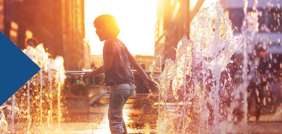 A photo of a young boy against a Philadelphia sunset from one of Boom Chicka's campaigns for PGW .
