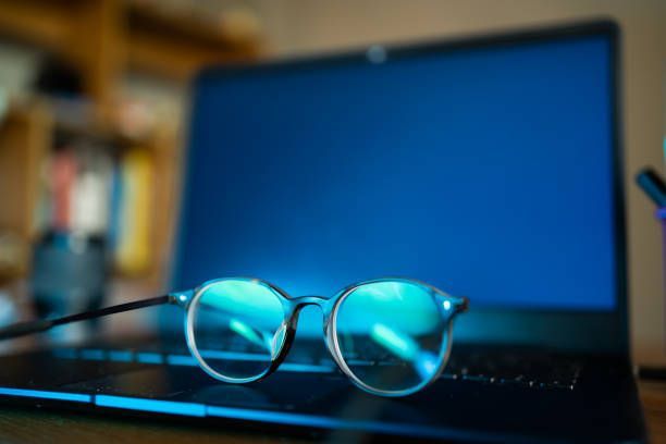 A pair of glasses is sitting on top of a laptop computer.