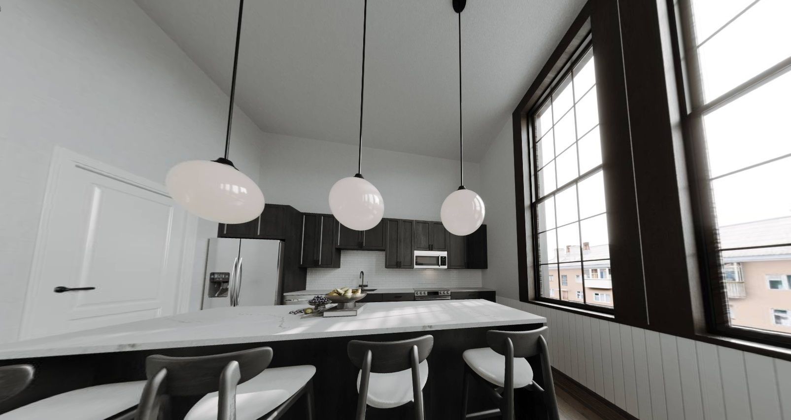 A kitchen with a large island and a lot of windows