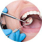 Dentist Checking Patients Teeth — Dental Care in Fresno, CA
