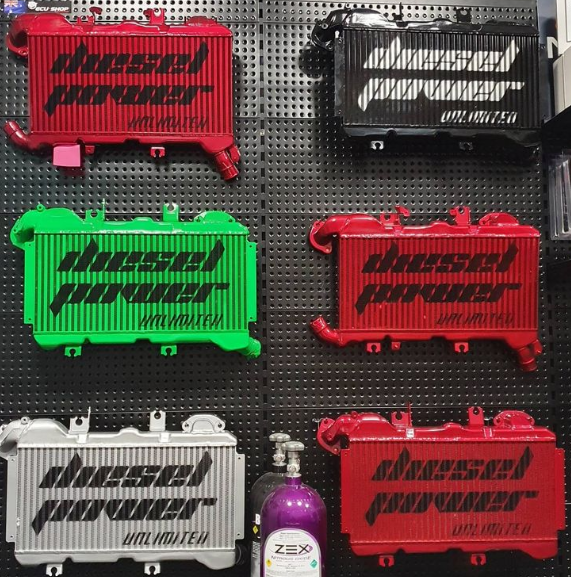 Several different colored DPU Intercoolers are displayed on a wall