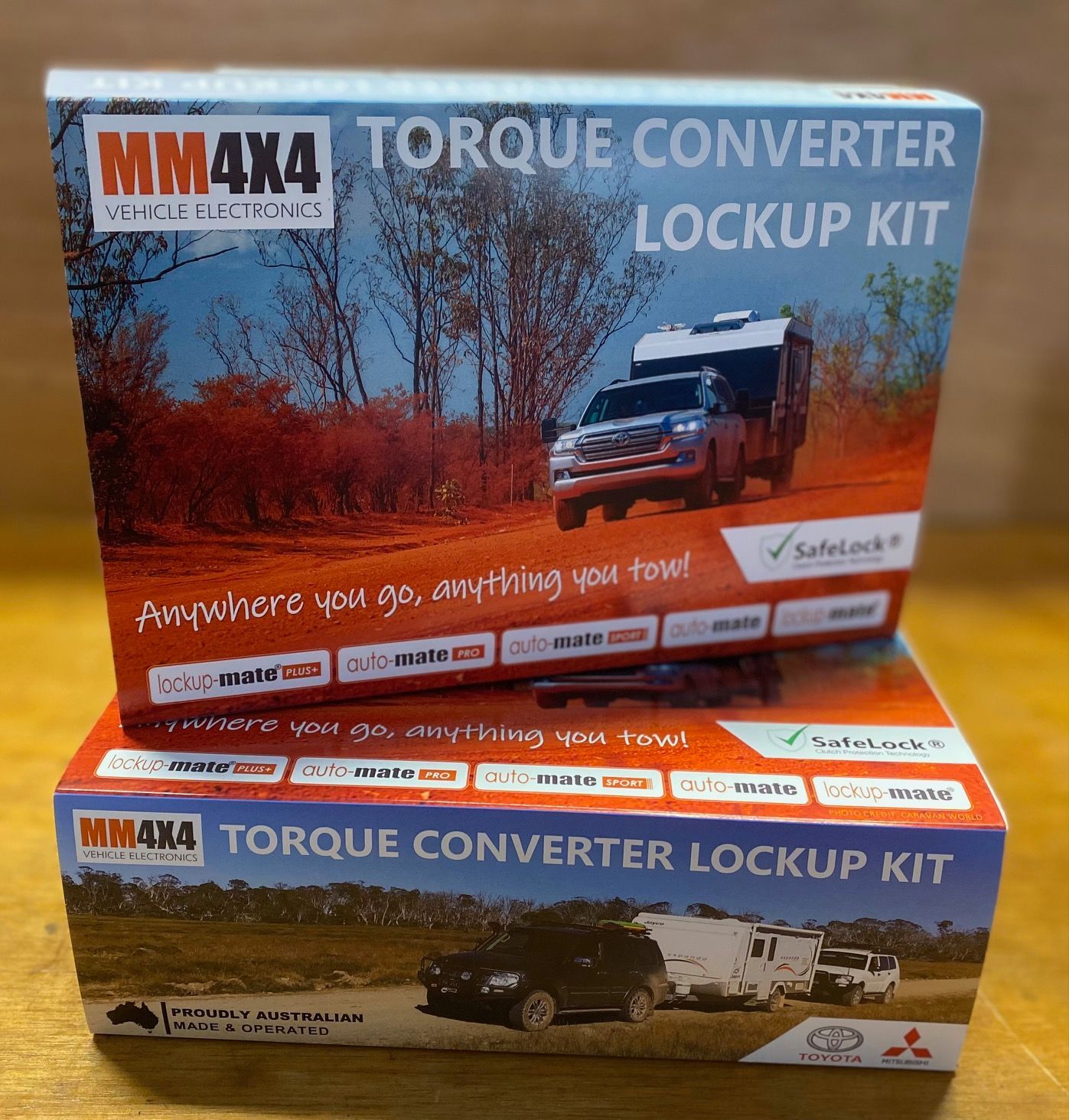 Two boxes of mm4x4 torque converter lockup kits sit on a table.