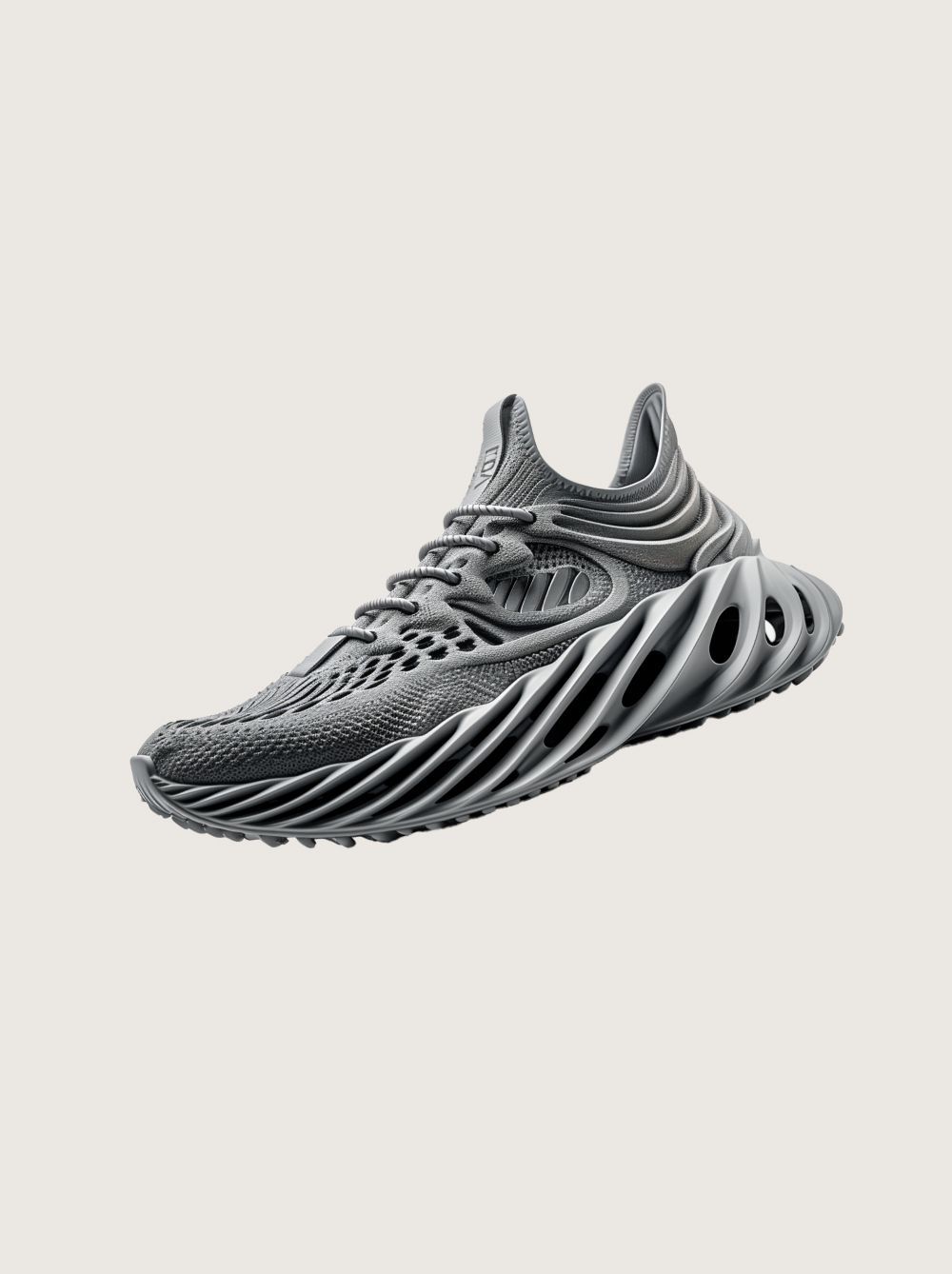 Gray athletic sneaker with a black-and-white striped sole on a light background