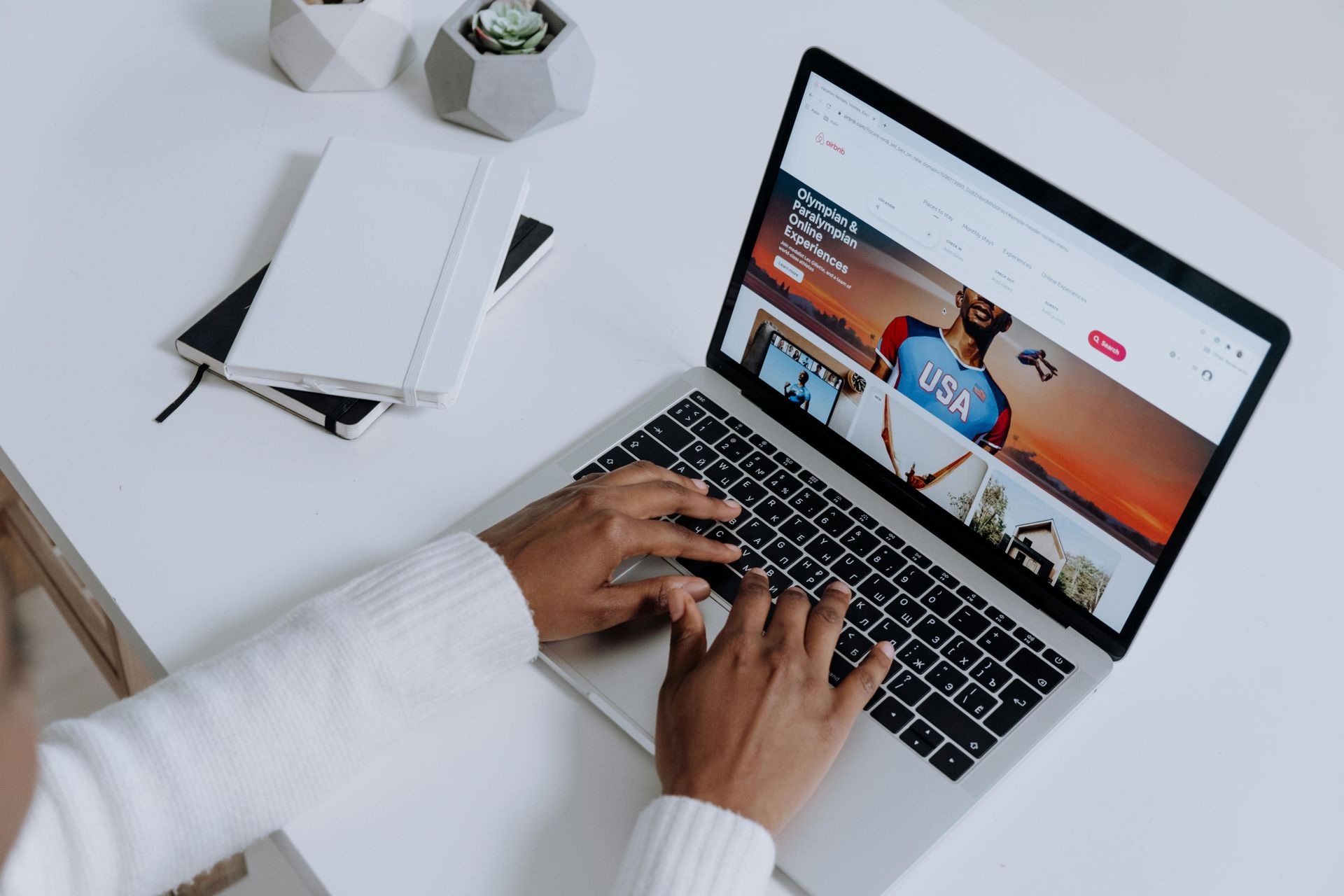 Person working on a laptop with a modern website open, representing professional web design for smal