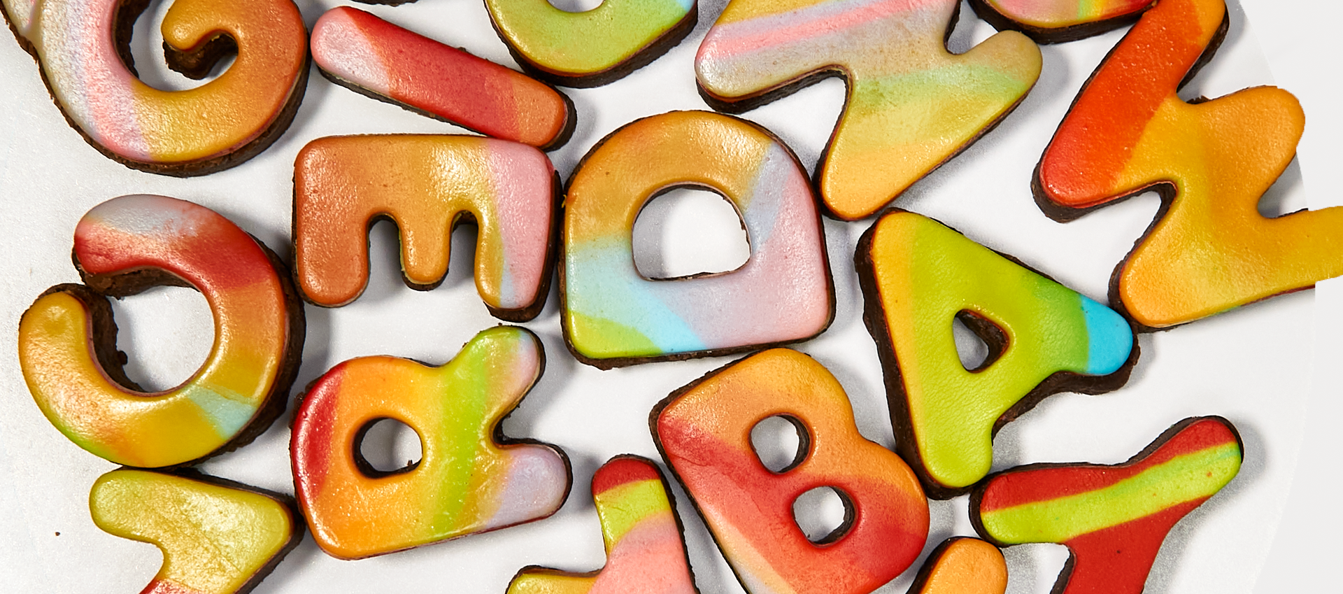 A pile of colorful letters and numbers on a white surface