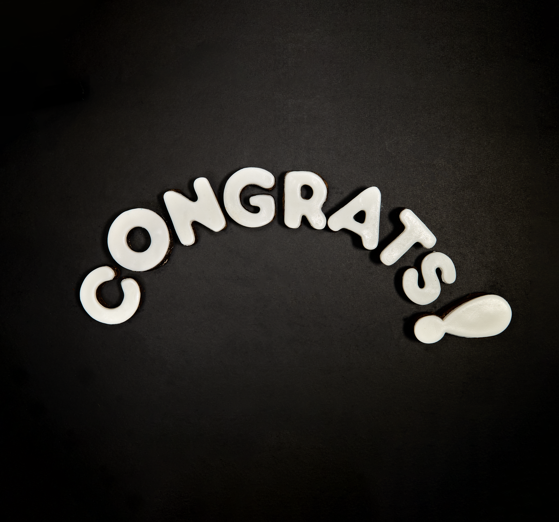 The word congrats is written in white letters on a black background
