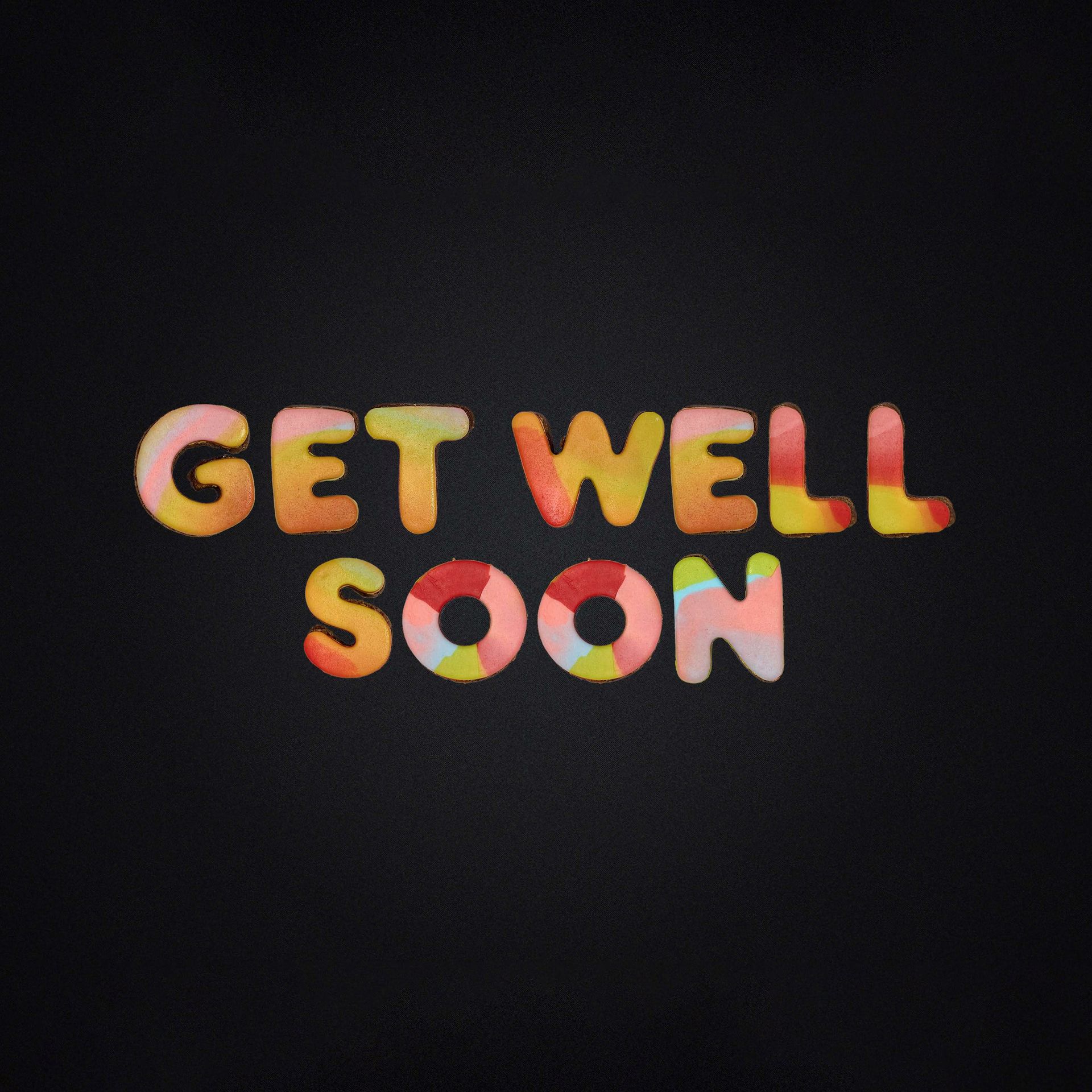 A sign that says get well soon on a black background
