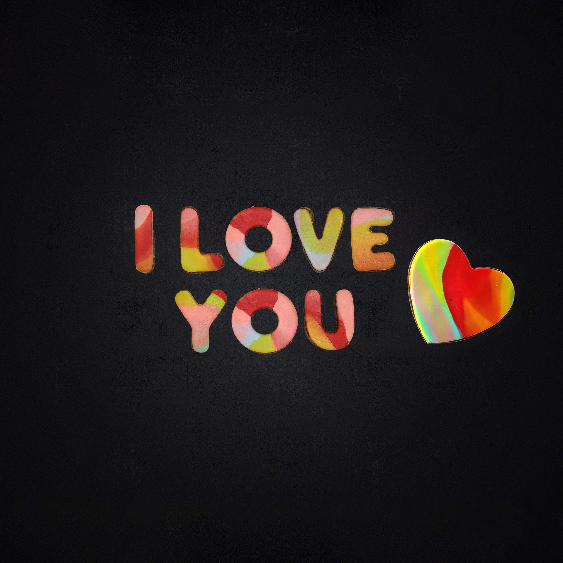 A black background with the words i love you and a heart