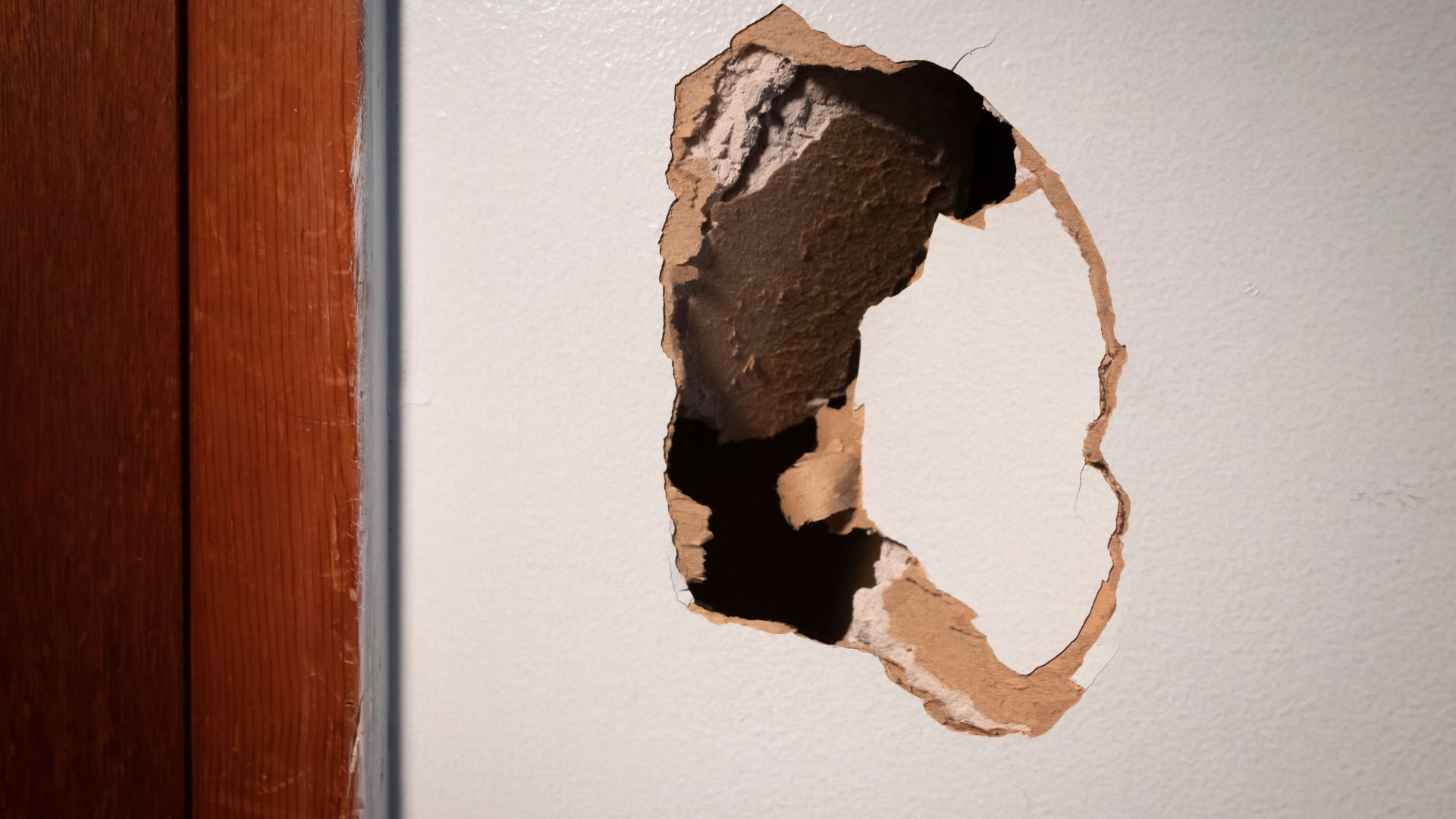 A hole in a wall that looks like the letter c