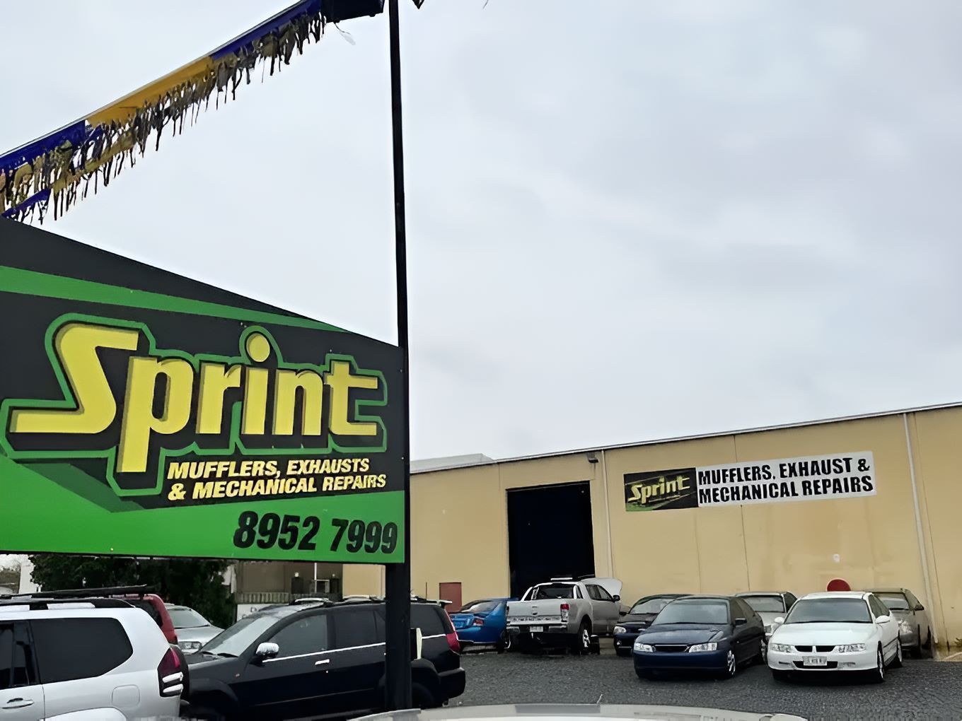A Bunch of Cars Are Parked in Front of a Building That Says Sprint — Sprint Mufflers, Exhausts & Mechanical Repairs in Stuart, NT
