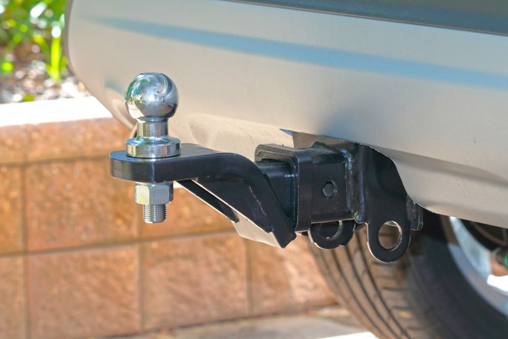 A Close Up of a Tow Bar Attached to the Back of a Car — Sprint Mufflers, Exhausts & Mechanical Repairs in Stuart, NT